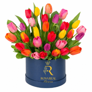 Caja de tulipanes de colores en sombrerera azul elegante
